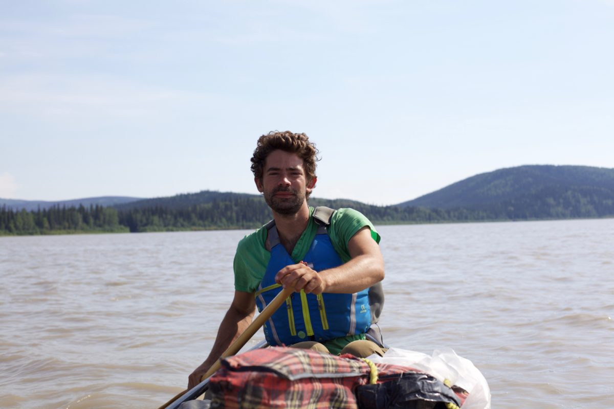 Adam Weymouth canoeing along the Yukon River