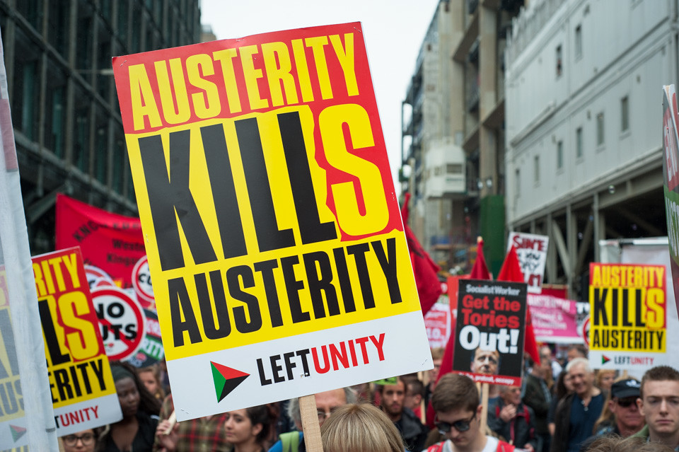 End Austerity "Austerity Kills" placard carried at a street protest