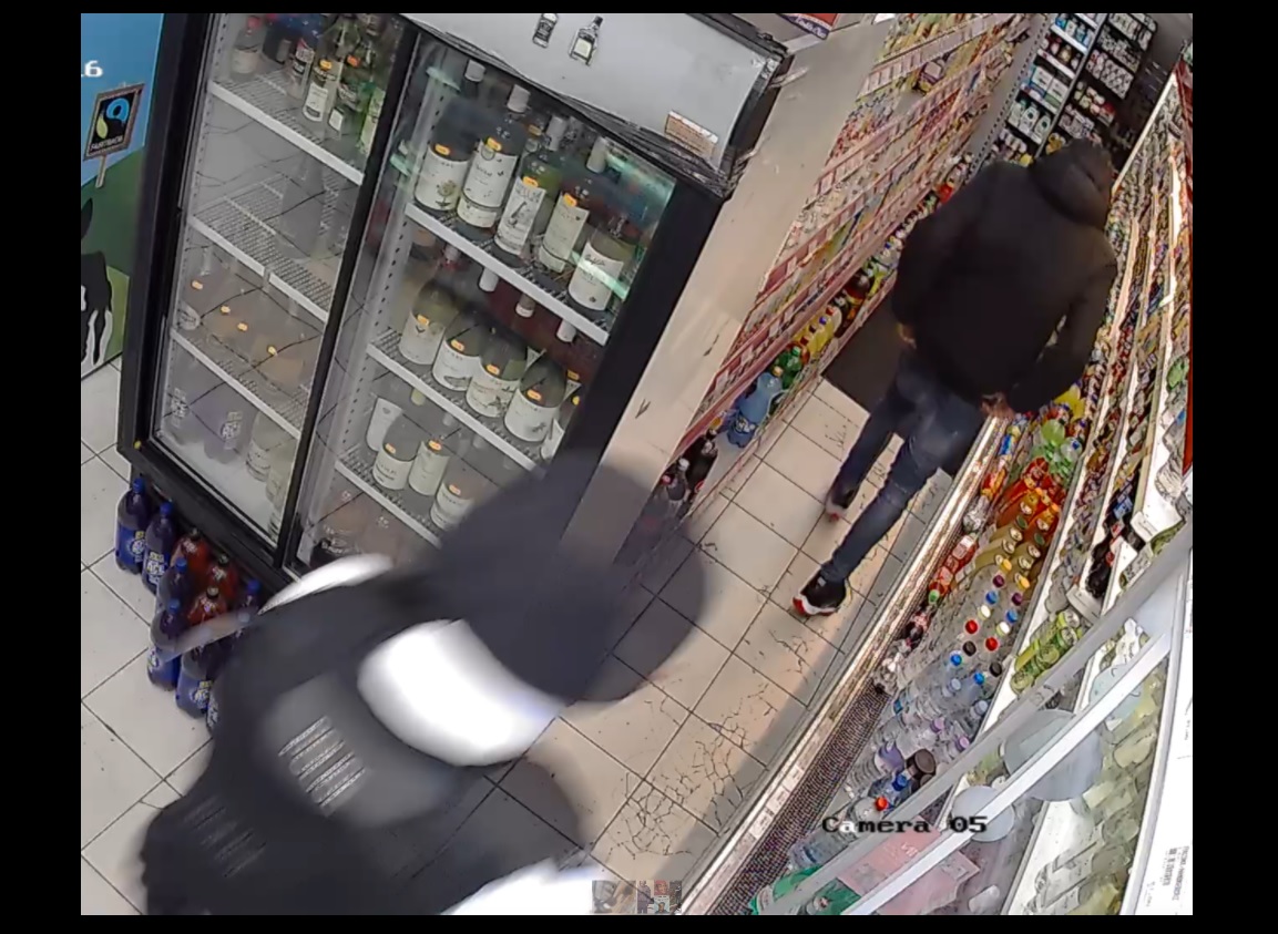 CCTV picture shows police officer pursuing Rashan Charles in London supermarket