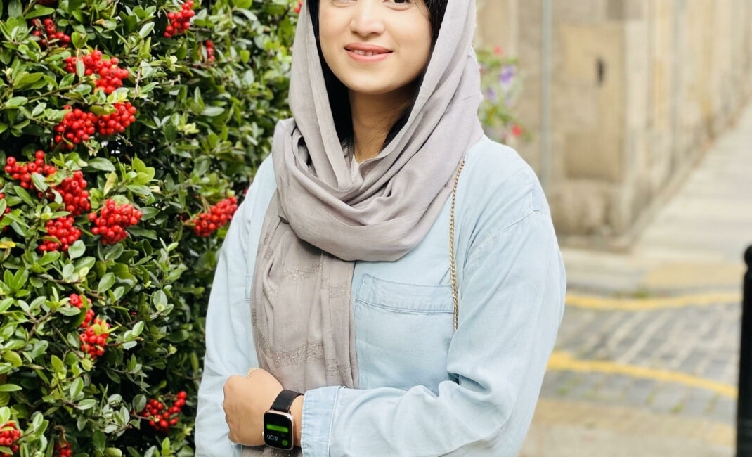Photo of Shazia Ramzan in a blue top with a grey head scarf