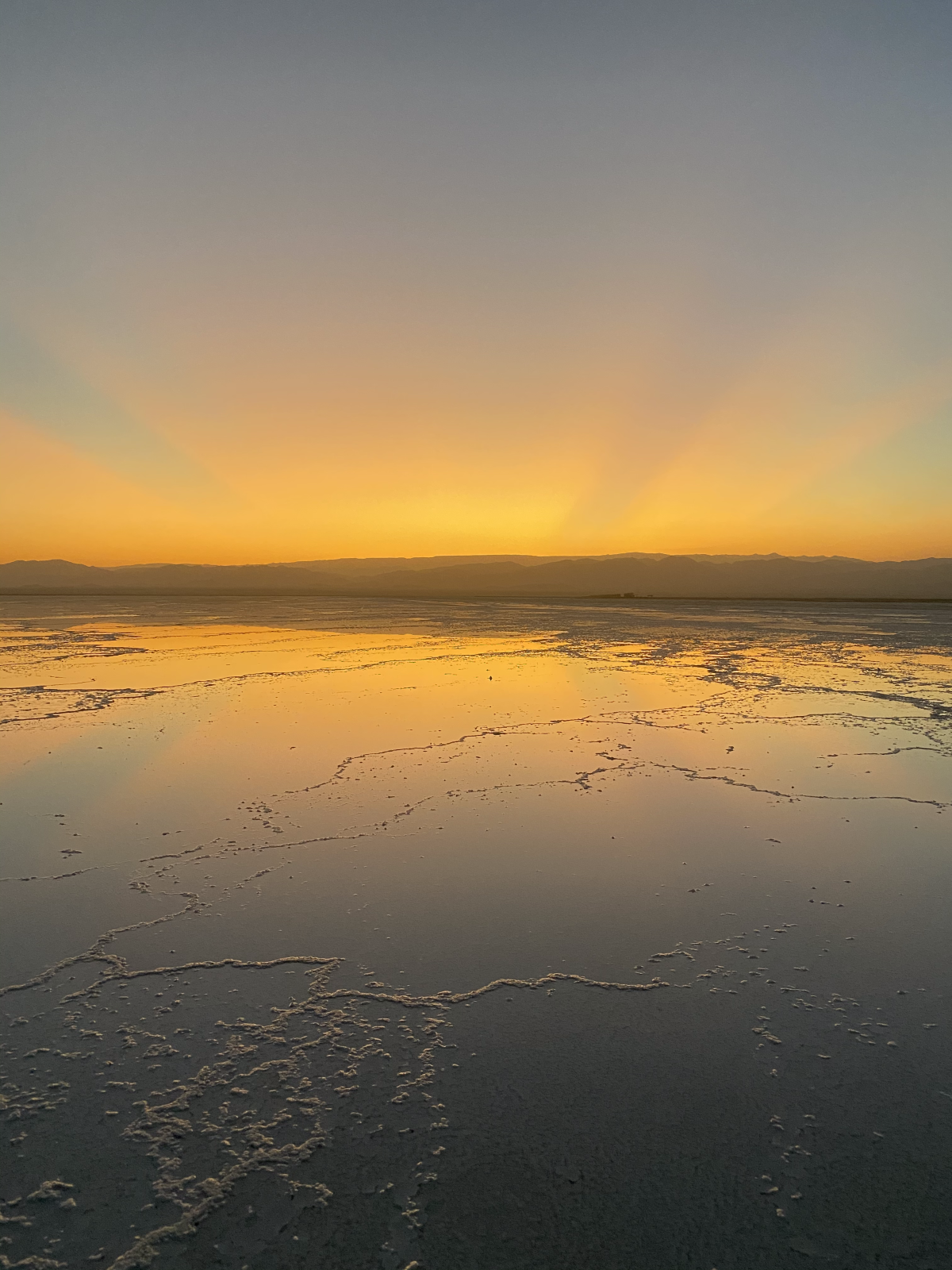 A sunset on the horizon of the salt lake