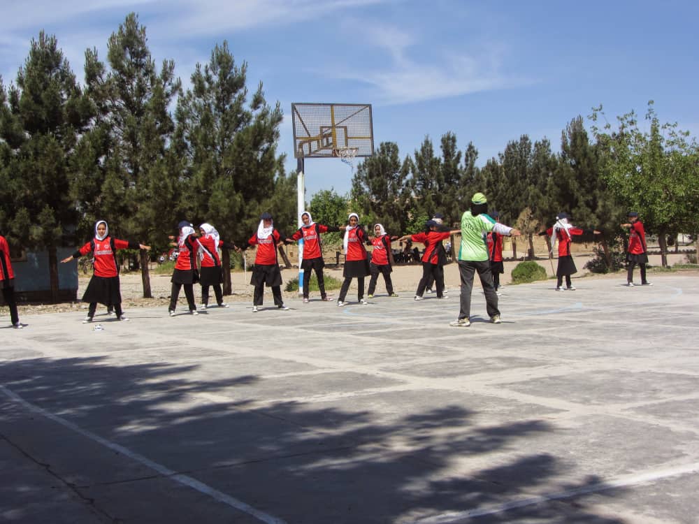 Firoza Wahedi training a group of girls at a basketball pitch - for Lacuna interview