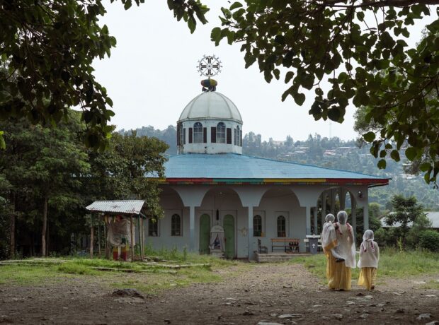 Photograph by Jaclynn Ashly showing the Light of St. George Church Ethiopia, located on the other side of the Qeha River - for Lacuna story on religious tensions in Ethiopia