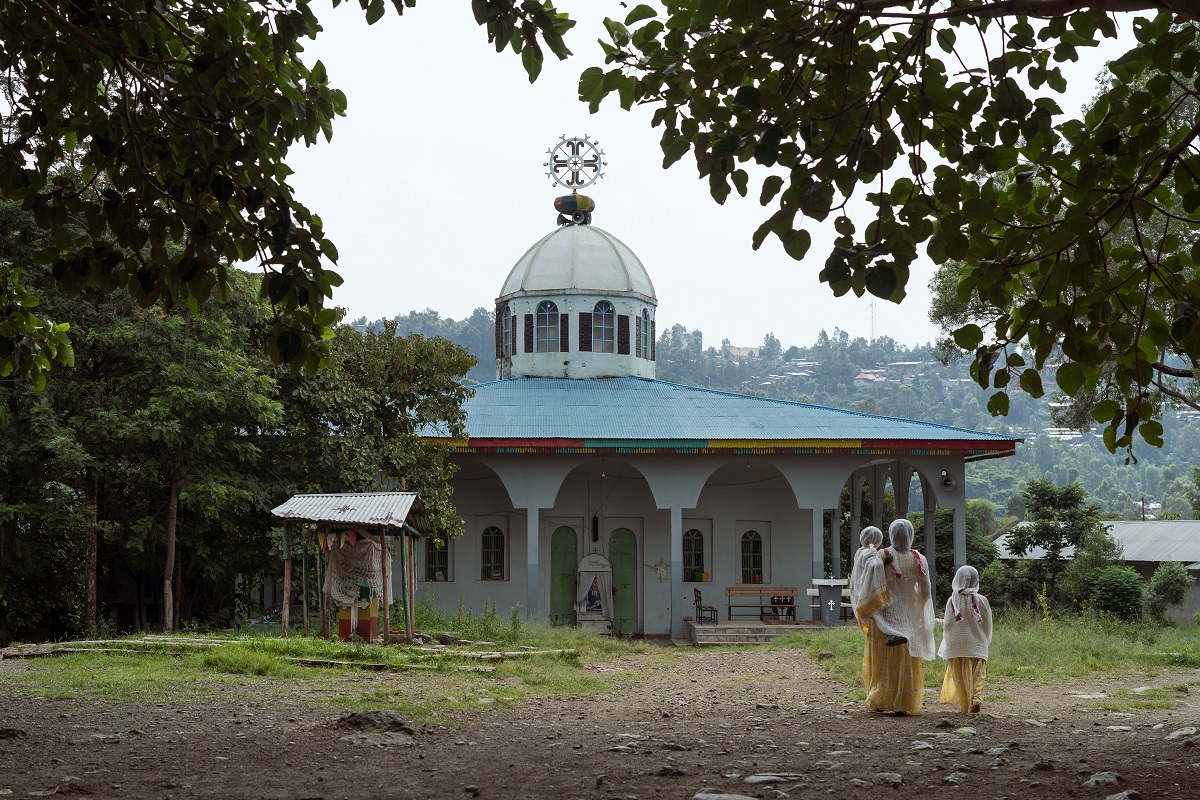 Photograph by Jaclynn Ashly showing the Light of St. George Church Ethiopia, located on the other side of the Qeha River - for Lacuna story on religious tensions in Ethiopia