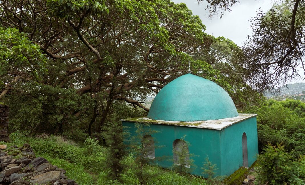 The turquoise Sheikh Ali Gondar's shrine in Addis Alem surrounded by trees:  Photograph by Jaclynn Ashly for Lacuna story on religious tensions in Ethiopia.