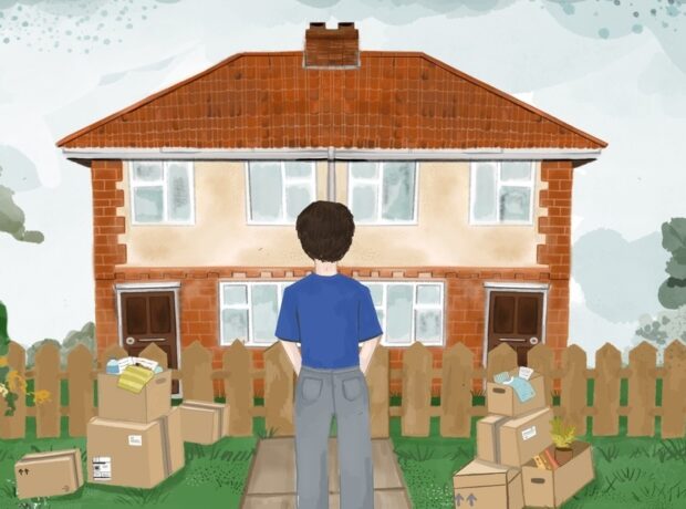 Man standing in front of their brick house, with cardboard boxes on the lawn, getting evicted after welfare payments stop in a time of bereavement.